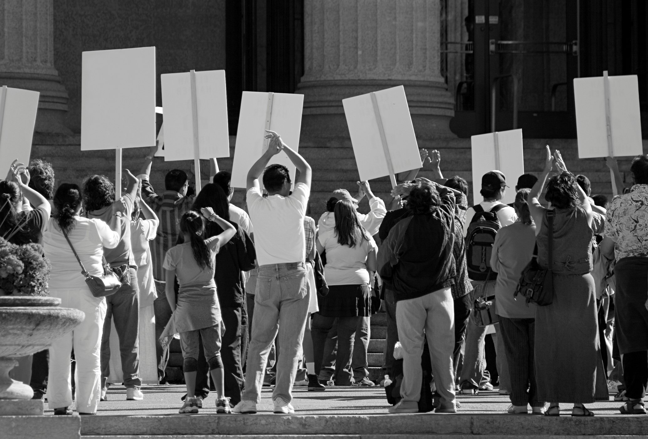 Demonstration. Protesting crowd with signs.